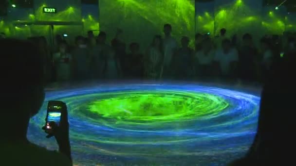 People look at impressive laser light 3D visualization — Stock Video