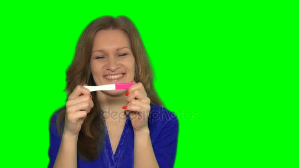 Beautiful woman dreaming with positive pregnancy test — Stock Video