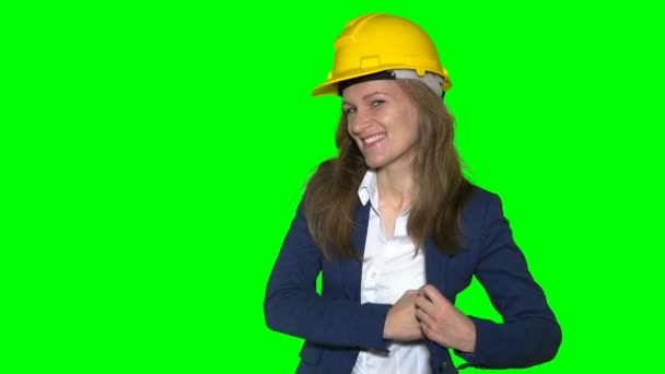 Female real estate agent with helmet give new house keys to new home owners — Stock Video