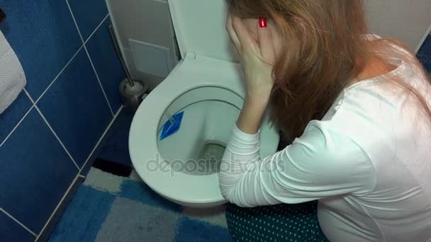 Pregnant female girl vomiting in toilet in bathroom. Sad woman morning sickness — Stock Video