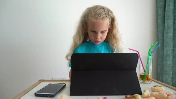 Adorable blond girl child play with tablet. Computer addict kid. Gimbal motion — 비디오