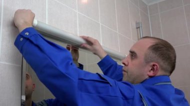 Electrician man worker remove burn out fluorescent lamp