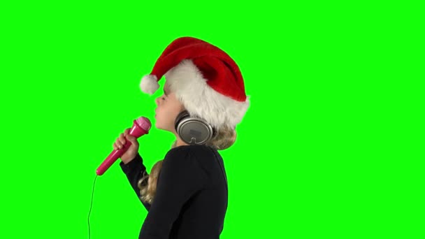 5 years old kid singing Christmas song with pink microphone — Wideo stockowe