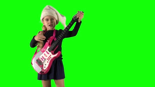 Charming child girl playing with toy guitar and sing on Christmas concert — Stock Video