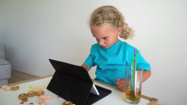 Serious office worker child make mistake sit by tablet computer. Gimbal motion — 图库视频影像