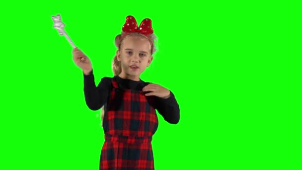 Blond magician girl with magic wand in hand speaking spell looking at camera — Stock Video