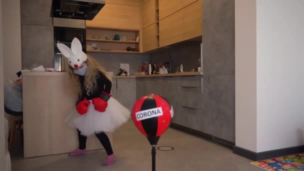 Active girl with bunny costume fighting corona virus covid-19 concept. — Stock Video