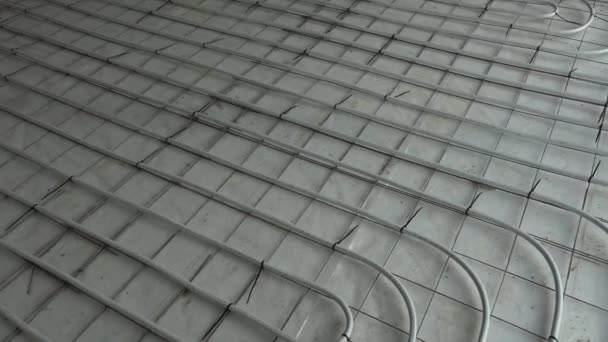 Panorama of network of pipelines of floor heating system in house — Stock Video