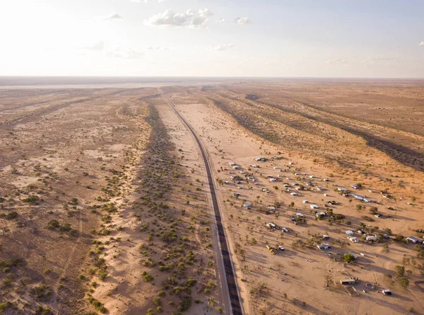 Aerial of desert road through arid landscape