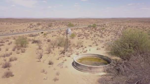 Aerial Waterpump Goats Desert Landscape — Stock Video