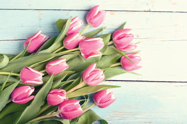 Bouquet of tulips on vintage wooden table Stock Image