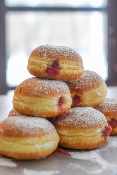 Donuts with jelly and sugar powder