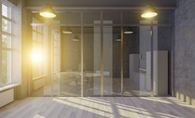 Üzerinde siyah duvar olan açık bir uzay ofisinin yan görüntüsü, üzerinde bilgisayar olan bir sürü masa ve ahşap döşeme. Gün batımı