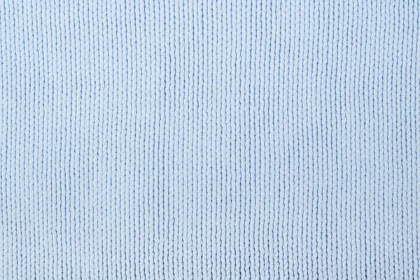 Maglione o sciarpa tessuto trama grande maglia. Sfondo in maglia jersey con motivo a rilievo. Macchina a mano in lana, fatta a mano, blu . — Foto Stock
