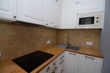 Kitchen in a Scandinavian style . Modern kitchen. Light solid wood Furniture. Interior. The kitchen room . Shelves. Russia, Saint Petersburg 29 February 2020