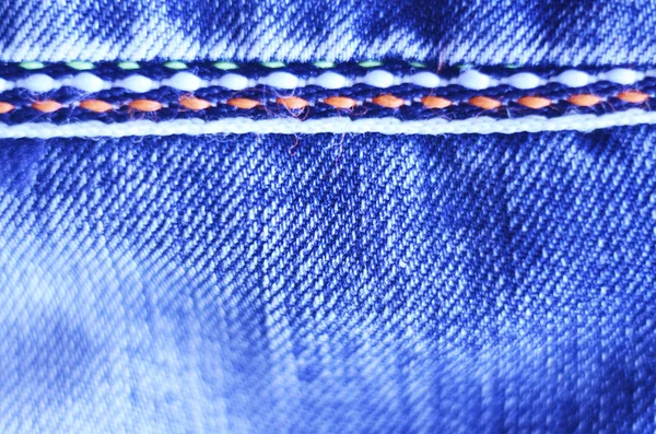 Modré džíny hadřík s šev pozadí textury Vignette. — Stock fotografie