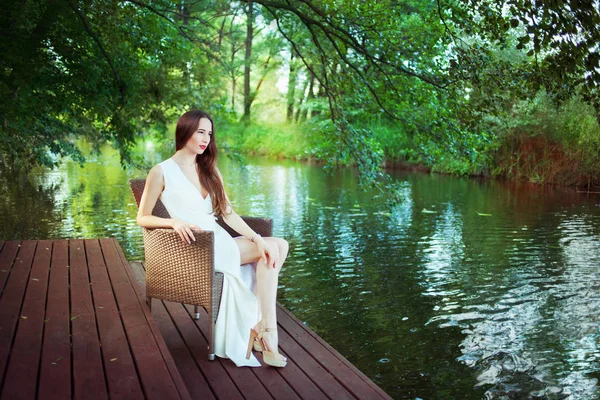 Beautiful woman in white dress — Stock Photo, Image