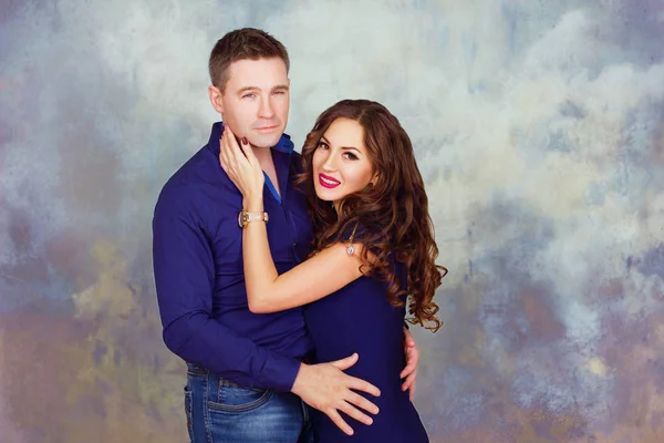 Young woman and man in the studio — Stock Photo, Image