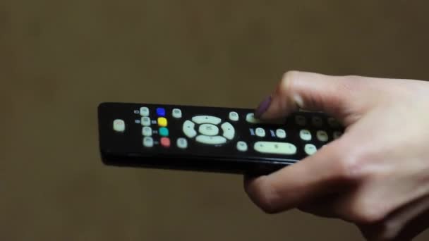 Female hand using TV remote Close-up — Stock Video