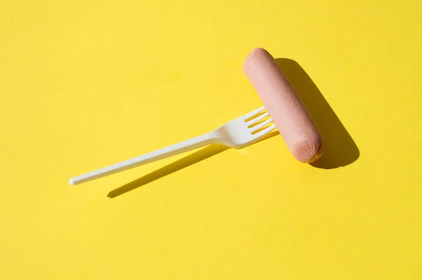 Sausage White Plastic Fork Bright Yellow Background Hard Light — Stock Photo, Image