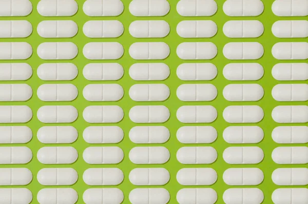 Візерунок Багато Білих Таблеток Зеленому Тлі — стокове фото