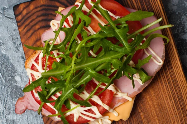 Appetizing Sandwich Ham Balyk Arugula Cheese Tomatoes Mayonnaise Cutting Board — Stock Photo, Image