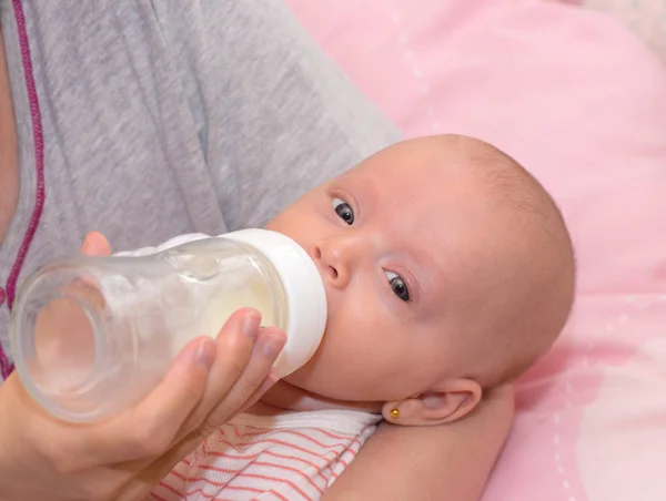 Small baby eating Stock Photo