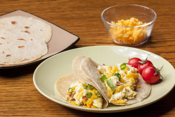 Cheddar cheese and breakfast burritos. — Stock Photo, Image