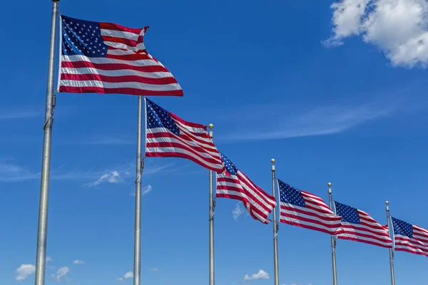 Row of flags and blue sky. — Stock Photo, Image