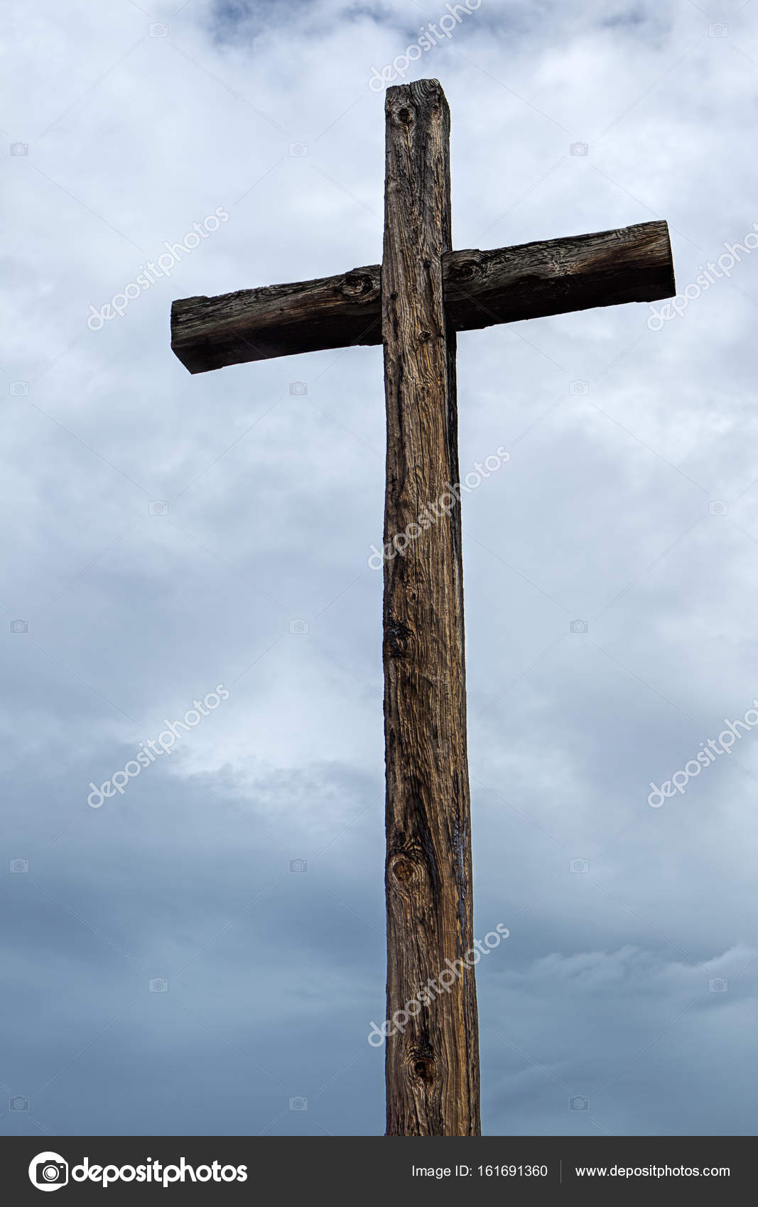 Old wood cross and cloudy sky. Stock Photo by ©gjohnstonphoto 161691360