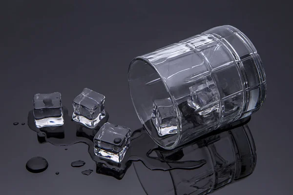 Spilled glass with ice. — Stock Photo, Image