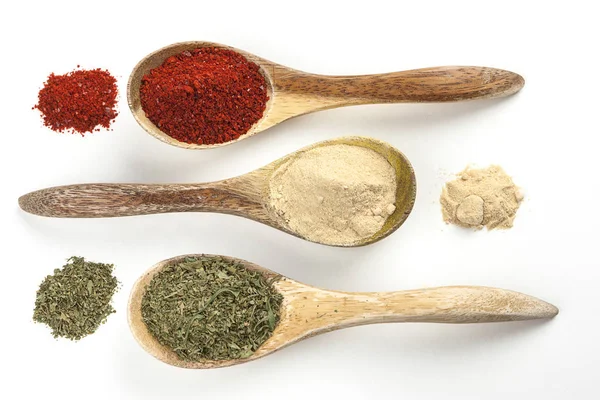 Cooking spices in spoons and piles. — Stock Photo, Image