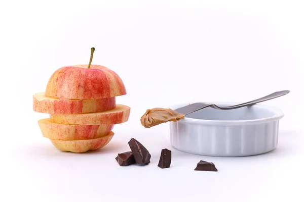 Apple, peanut butter, and chocolate. — Stock Photo, Image