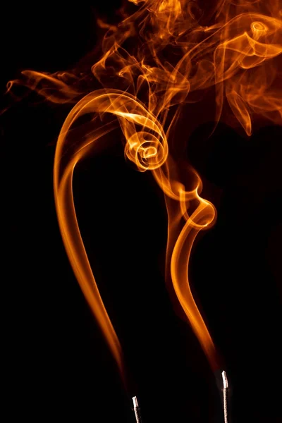 Interesting shpe of orange smoke. — Stock Photo, Image