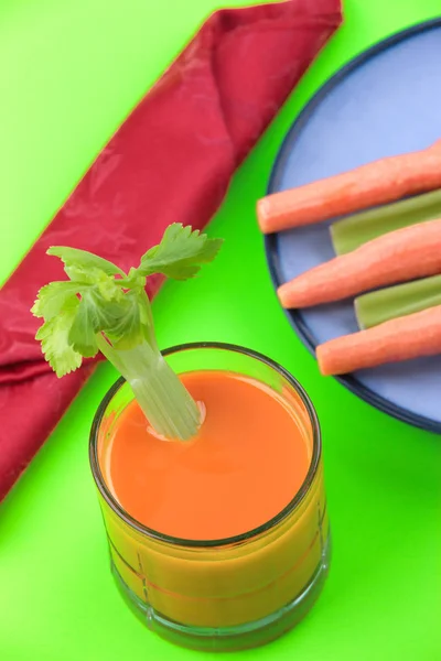 Glass of carrot juice with celery. — Stock Photo, Image