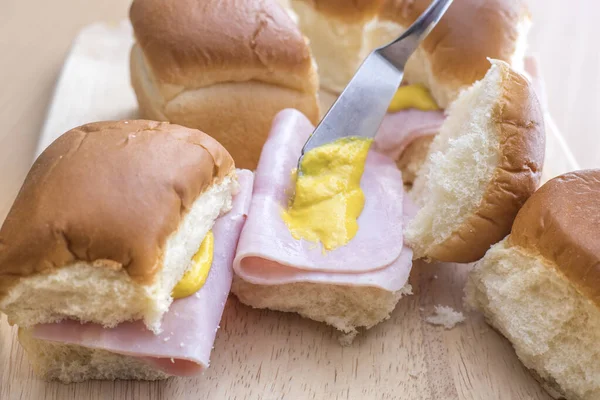 Ham on rolls with mustard. — Stock Photo, Image