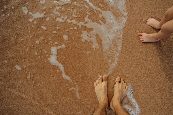 Legs of child on the sand — Stock Photo, Image