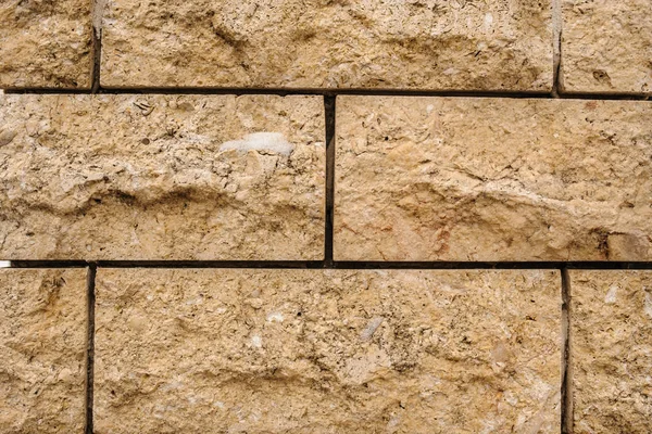 ladrillo de piedra natural color crema amarillento fondo — Foto de