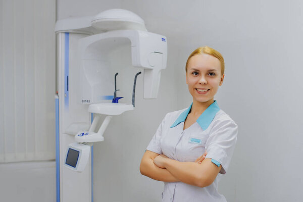 dentist smiling in panoramic teeth x ray office