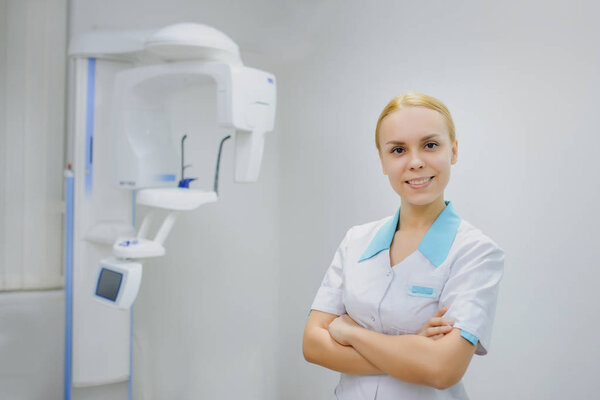 dentist smiling in panoramic teeth x ray office
