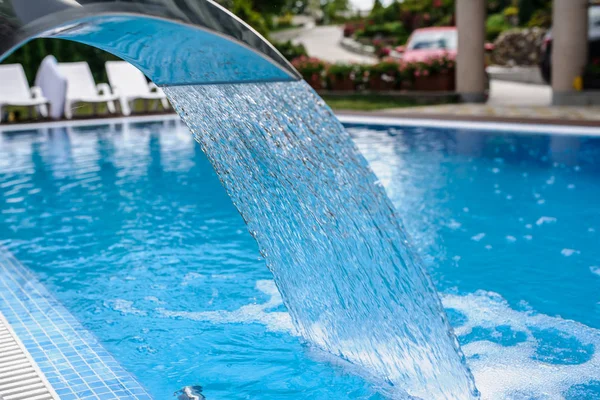 View of a empty swimming pool with blue wa