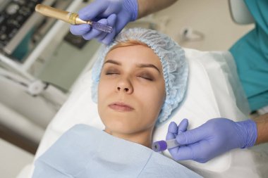 Closeup of a woman recieving microdermabrasion procedure on the elbow