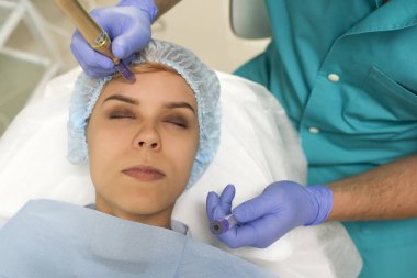 Closeup of a woman recieving microdermabrasion procedure on the elbow
