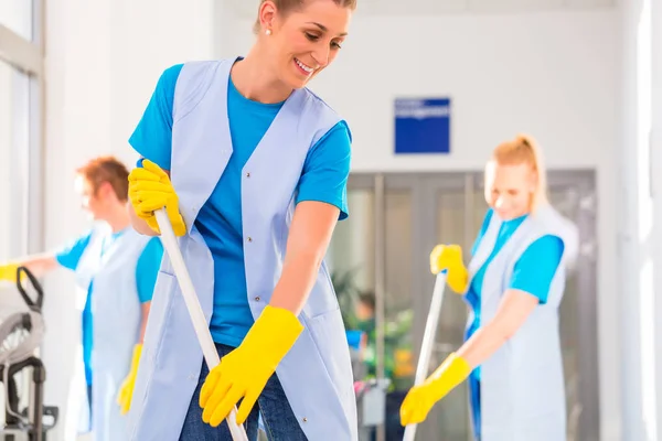 Commercial cleaning brigade working — Stock Photo, Image