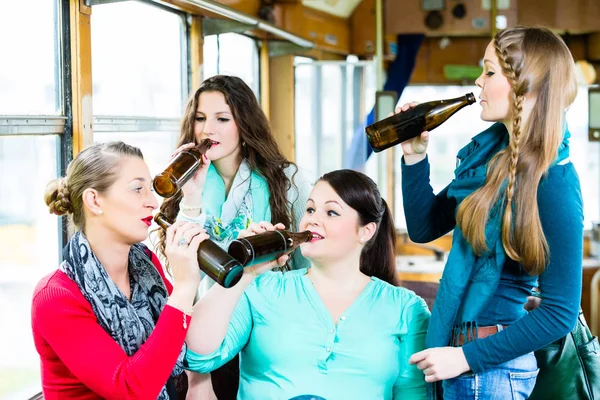 Group of people in tram bar having beer party — Stock Photo, Image