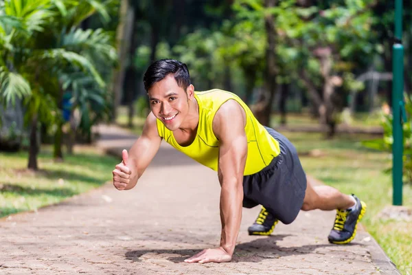 Proud and successful man doing sport push-up
