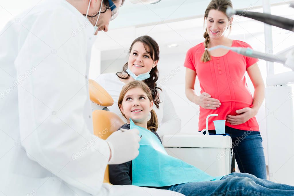 Dentists treating family 