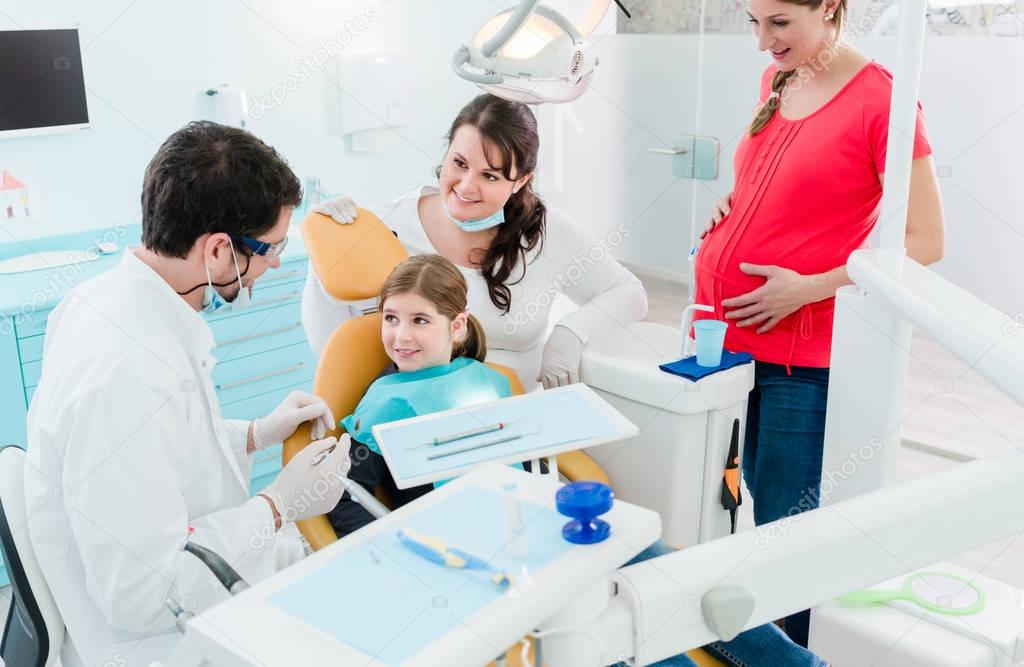 Dentists treating  family 