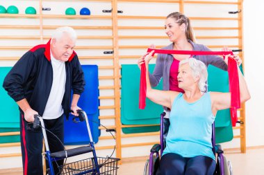 Seniors in physical rehabilitation therapy clipart