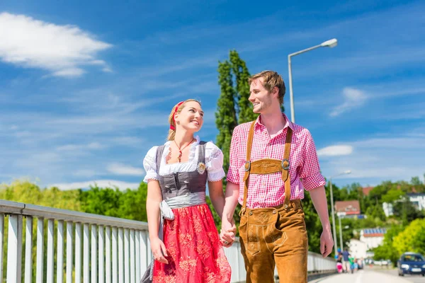 Couple visiting Bavarian fair having fun — Stock Photo, Image